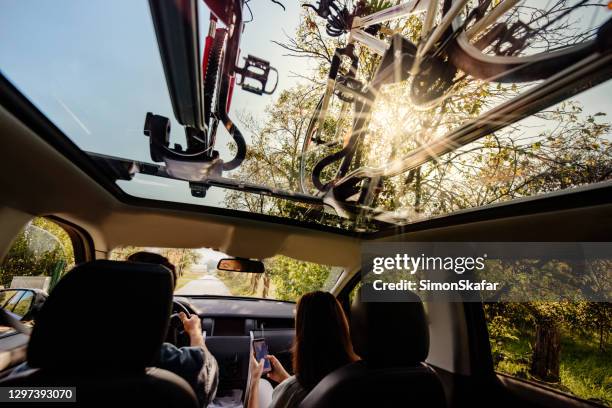 bicycle on the bike rack on see trough roof - inside out stock pictures, royalty-free photos & images