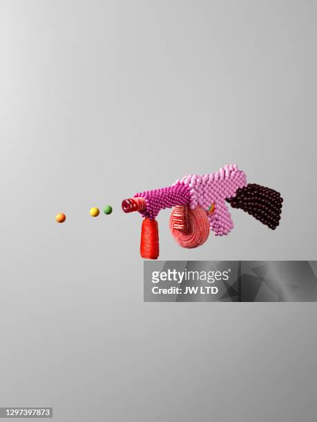 sweet weapons - colourful studio shots stock-fotos und bilder