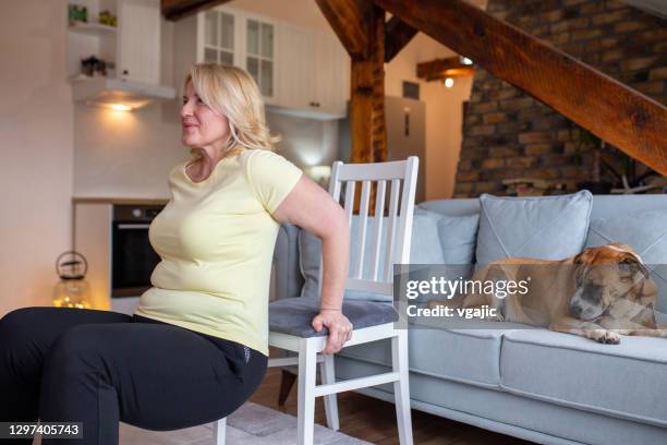 easy chair workouts to help her get fit - chair stock pictures, royalty-free photos & images