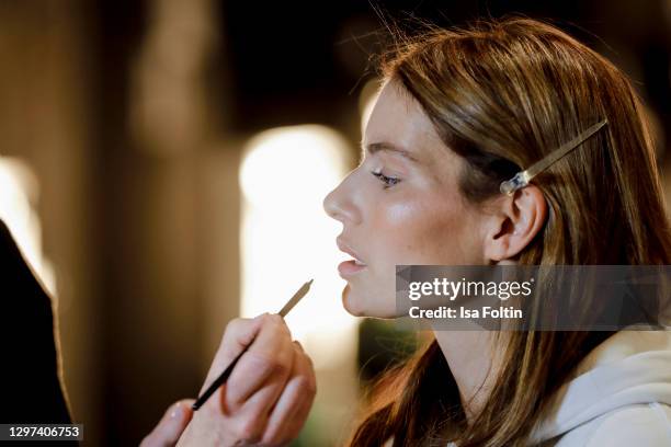 In this image released on January 19, German actress Rebecca Kunikowski is seen backstage ahead of the Lana Mueller show during the Mercedes-Benz...