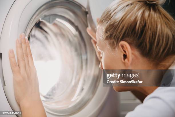 Female Washing Machine Photos and Premium High Res Pictures - Getty Images