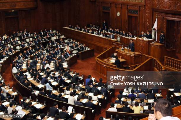 Japanese Prime Minister Shinzo Abe answers questions by an opposition Constitutional Democratic Party of Japan leader Yukio Edano for his policy...