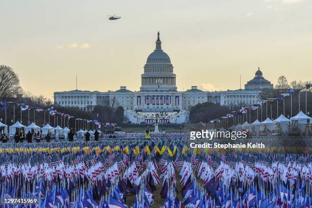 Marine One carrying President Donald Trump and first lady Melania Trump as they departed from the White House flies over the U.S. Capitol ahead of...