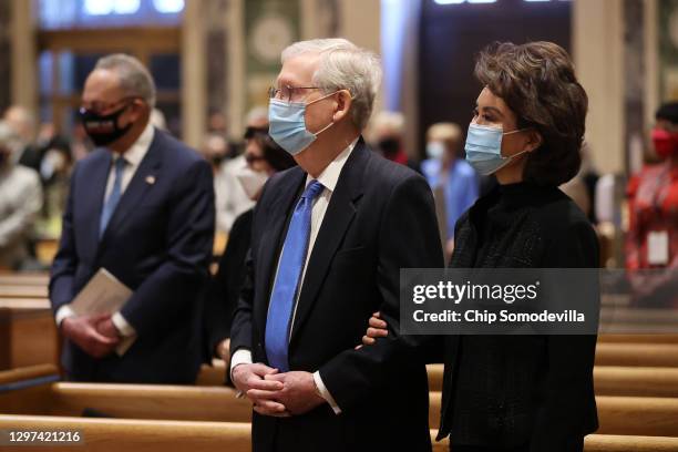 Senate Majority Leader Mitch McConnell and former Secretary of Transportation Elaine Chao attend services at the Cathedral of St. Matthew the Apostle...