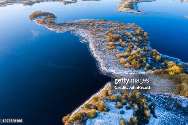 the view from a drone looking down on calm water on a frosty morning in south west scotland - dumfries and galloway stock pictures, royalty-free photos & images