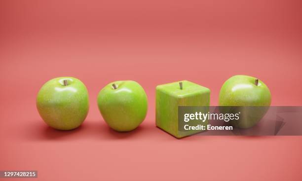 manzana en forma de cubo - fake fotografías e imágenes de stock