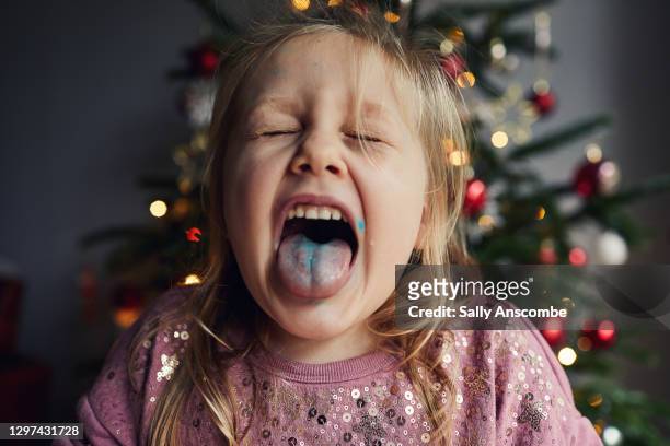 little girl with her tongue out - fondant stock pictures, royalty-free photos & images