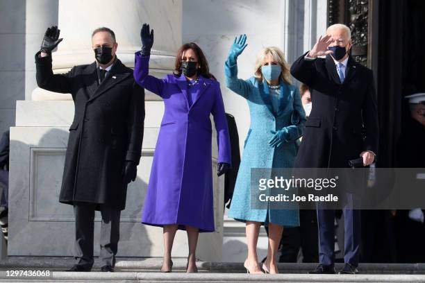 Doug Emhoff, U.S. Vice President-elect Kamala Harris, Jill Biden and President-elect Joe Biden wave as they arrive on the East Front of the U.S....