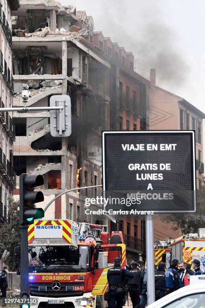 Flames and plumes of smoke rise after six floors collapsed on a building after a large explosion on Toledo Street in central Madrid on January 20,...