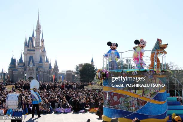 Disney characters Mickey, Minnie Mouse and Pluto, dressed in traditional kimono dresses, greet guests from a float during the theme park's annual New...