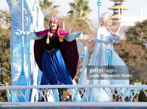 Disney movie "Frozen" characters Anna and Elsa perform on the float during a parade for Christmas at the Tokyo Disneyland at Urayasu, suburban Tokyo...