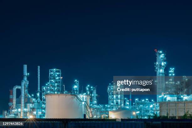 oil refinery with tube and oil tank along twilight at beautiful, refinary plant with oil tank storage, petrochemical plant - gas works stock pictures, royalty-free photos & images