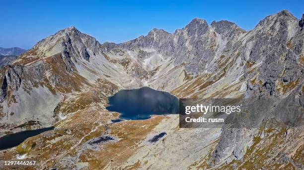 aerial view of mengusovska valley and velke hincovo pleso (lake) in, high tatras mountains, slovakia - tatras slovakia stock pictures, royalty-free photos & images