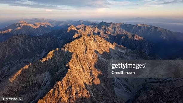 aerial view of sunrise over of gerlachov peak (gerlachovsky stit) in high tatras (vysoke tatry) mountains, slovakia - tatras slovakia stock pictures, royalty-free photos & images