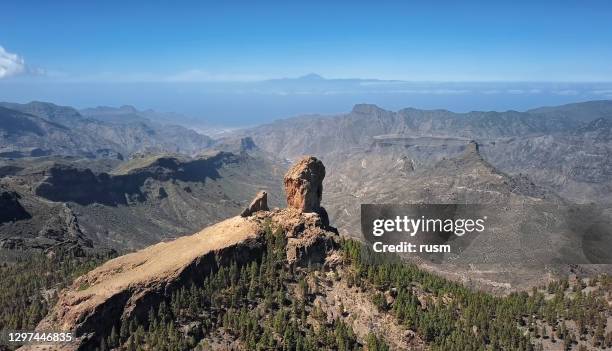 aerial view of roque nublo, a volcanic rock in caldera of tejeda, gran canaria, canary islands, spain. - tejeda stock pictures, royalty-free photos & images