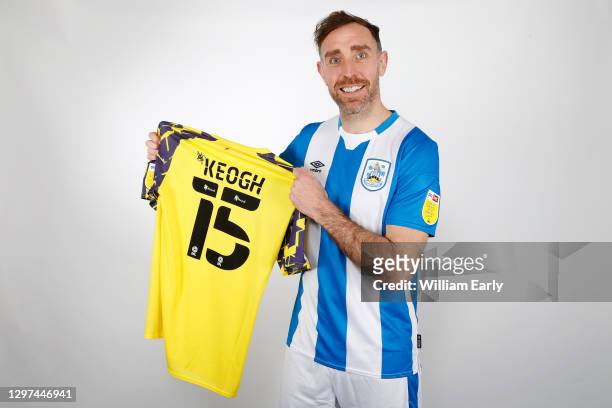 Richard Keogh signs for Huddersfield Town from MK Dons at PPG Canalside on January 18, 2021 in Huddersfield, England.