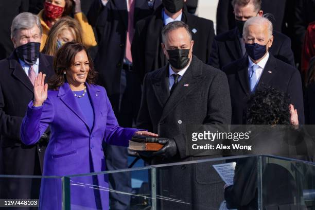 Kamala Harris is sworn in as U.S. Vice President by U.S. Supreme Court Associate Justice Sonia Sotomayor as her husband Doug Emhoff looks on at the...