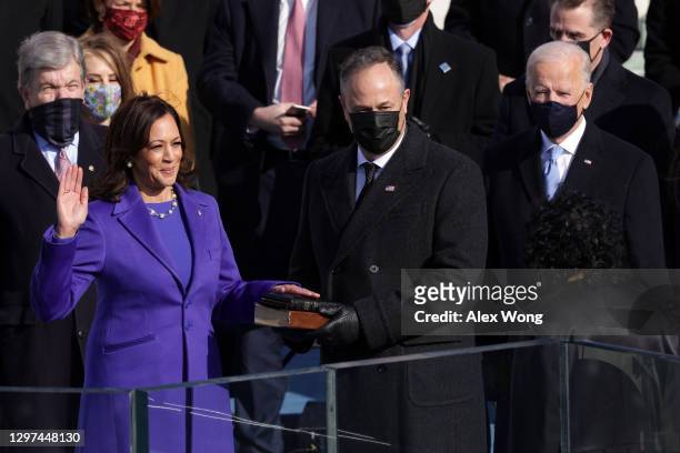 Kamala Harris is sworn in as U.S. Vice President by U.S. Supreme Court Associate Justice Sonia Sotomayor as her husband Doug Emhoff looks on at the...