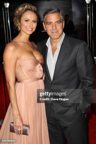 Stacy Keibler and George Clooney attend the premiere for 'The Descendants' at The 55th BFI London Film Festival at The Odeon Leicester Square on...