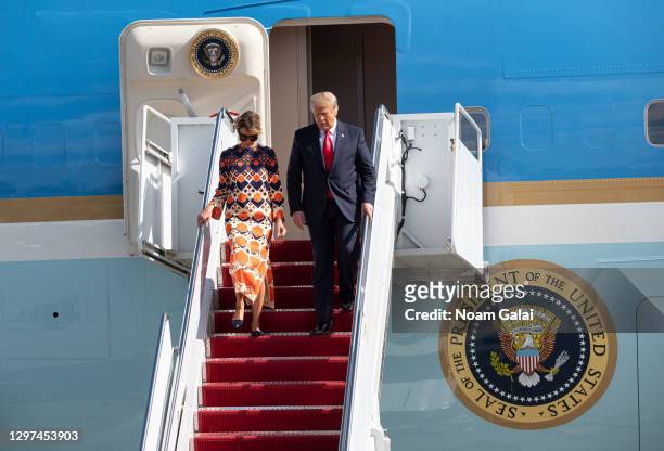 Outgoing U.S. President Donald Trump and First Lady Melania Trump exit Air Force One at the Palm Beach International Airport on the way to Mar-a-Lago...