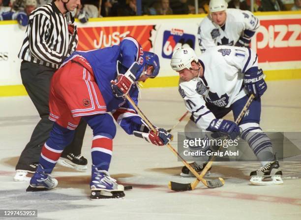 Steve Sullivan of the Toronto Maple Leafs skates against Wayne Gretzky of the New York Rangers during NHL game action on December 19, 1998 at Maple...
