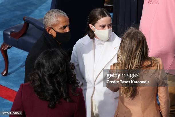 Naomi Biden and Natalie Biden, granddaughters of U.S. President-elect Joe Biden, speak with former U.S. President Barack Obama and former First Lady...