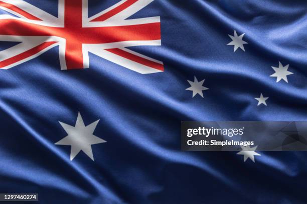 australia flag blowing in the wind. - australia flag stock pictures, royalty-free photos & images