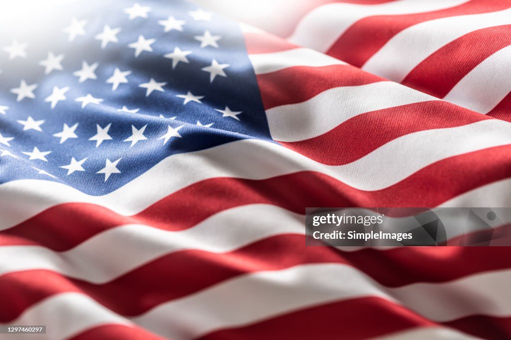 American flag blowing in the wind.