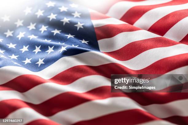 american flag blowing in the wind. - north america flag stock pictures, royalty-free photos & images