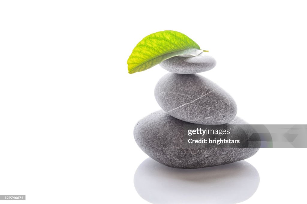 Balanced stones on white background