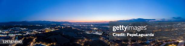 aerial panorama of city at dusk - granollers stock pictures, royalty-free photos & images