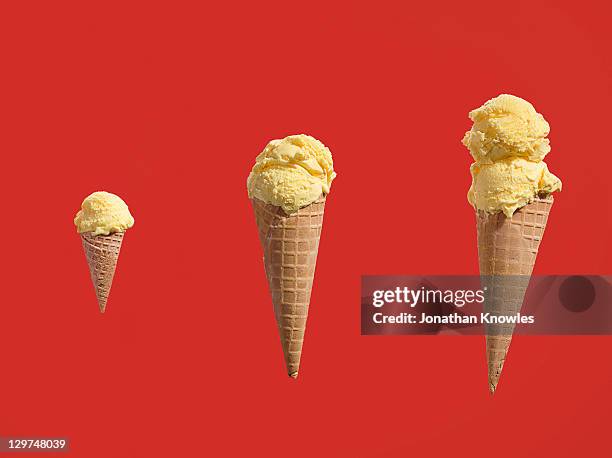 row of ice creams with different amounts of scoops - triple stock pictures, royalty-free photos & images