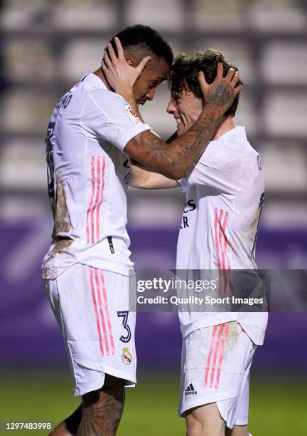 Eder Militao of Real Madrid celebrates after scoring his team's first goal with his teammate Alvaro Odriozola during the Copa del Rey third round...