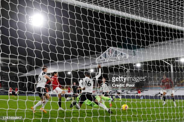 Edinson Cavani of Manchester United scores their team's first goal during the Premier League match between Fulham and Manchester United at Craven...