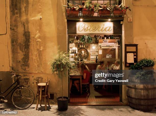 people dining inside an osteria - florence - italy photos et images de collection