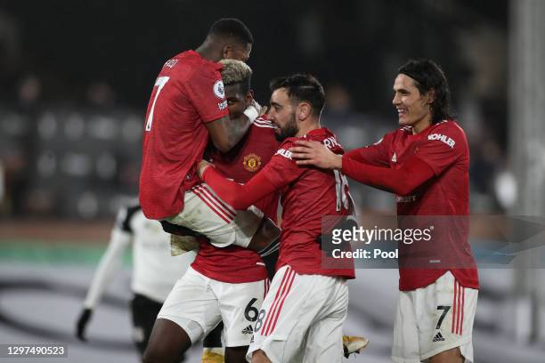 Paul Pogba of Manchester United celebrates with team mates Fred, Bruno Fernandes and Edinson Cavani after scoring their side's second goal during the...
