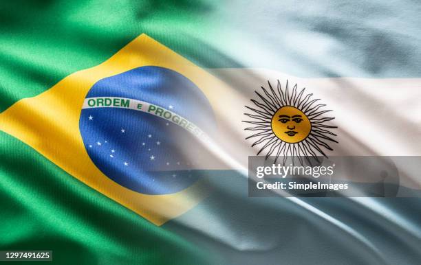 brazil and argentina flags blowing in the wind - collage. - cultura argentina imagens e fotografias de stock