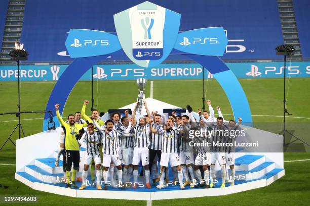 Giorgio Chiellini of Juventus lifts the PS5 Supercup after their side's victory in the Italian PS5 Supercup match between Juventus and SSC Napoli at...