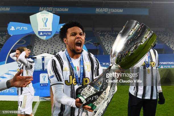 Weston McKennie of Juventus celebrates with the PS5 Supercup after victory in the Italian PS5 Supercup match between Juventus and SSC Napoli at Mapei...