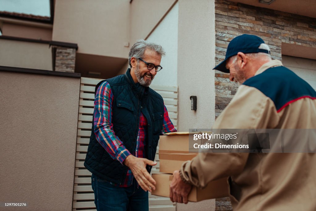 Delivery man delivering a package to the customer