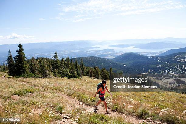 woman hiking in the summer - idaho stock-fotos und bilder