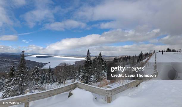 lake mooselookmeguntic near rangeley, maine usa during winter with tourist - mooselookmeguntic lake stock pictures, royalty-free photos & images