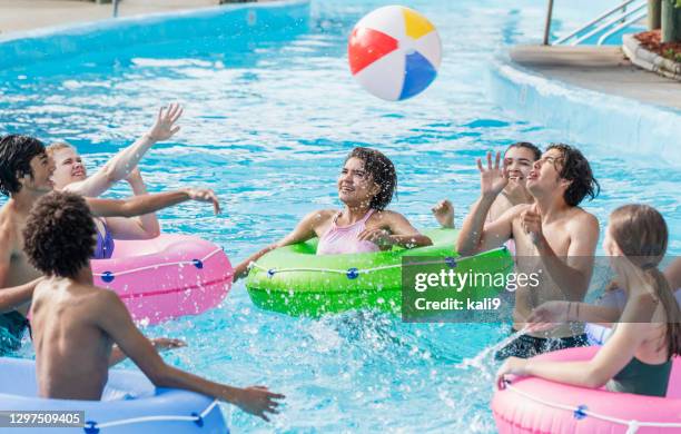 teenagers at water park playing in lazy river - lazy river stock pictures, royalty-free photos & images