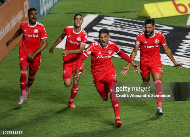 Victor Cuesta of Internacional celebrates with his team mates after scoring the first goal of their team during the match against Sao Paulo as part...
