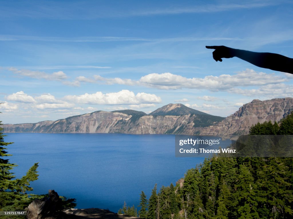 Person pointing at Lake