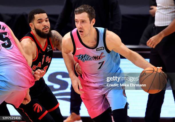 Goran Dragic of the Miami Heat drives on Fred VanVleet of the Toronto Raptors during a game at Amalie Arena on January 20, 2021 in Tampa, Florida....