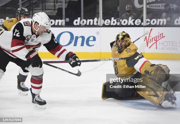 Marc-Andre Fleury of the Vegas Golden Knights makes a save against Johan Larsson of the Arizona Coyotes in the first period of their game at T-Mobile...