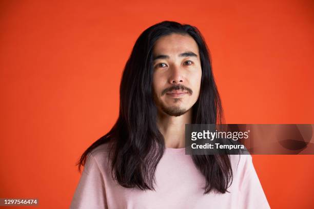 young man headshot portrait looking at the camera. - long hair stock pictures, royalty-free photos & images