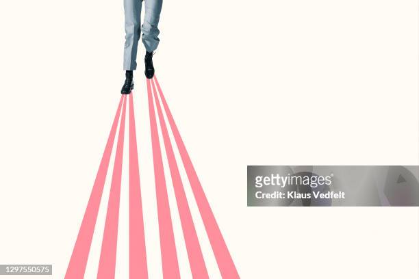 woman walking on pink parallel beams - parallel stock pictures, royalty-free photos & images