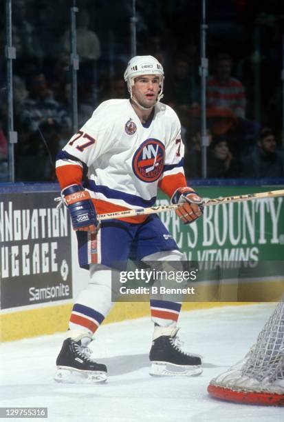 Pierre Turgeon of the New York Islanders skates behind the net during an NHL game in January, 1993 at the Nassau Coliseum in Uniondale, New York.